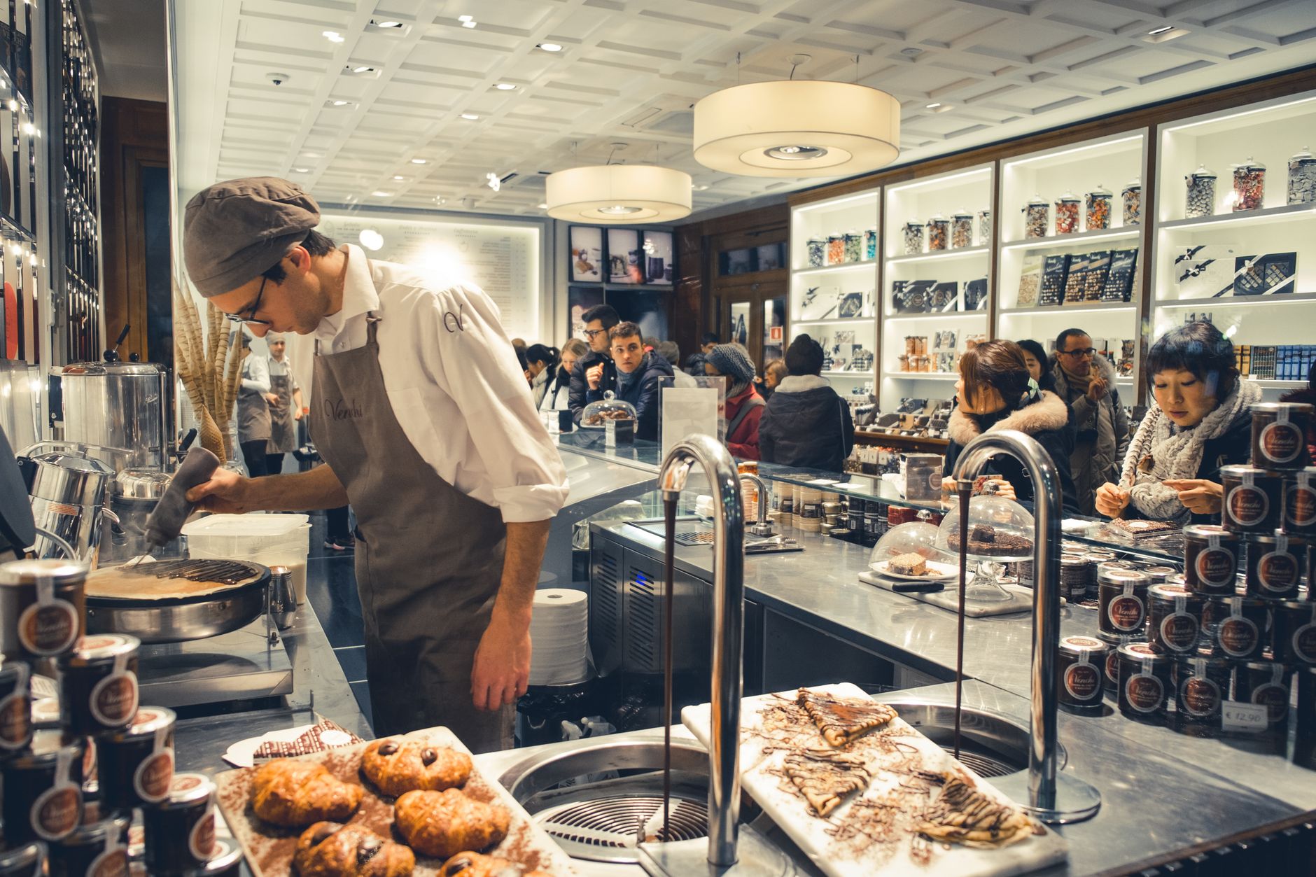 Bakery with busy counter and financial ledger showing minimal profit.