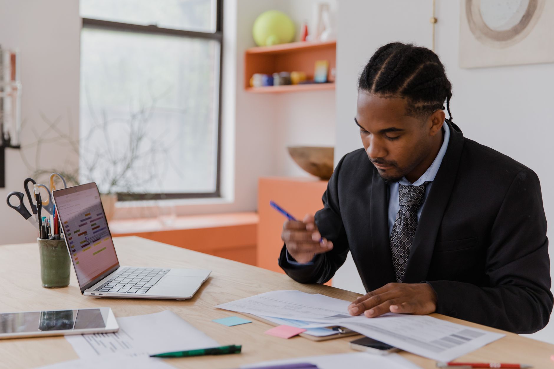 Small business owner reviewing a financial dashboard on a laptop.