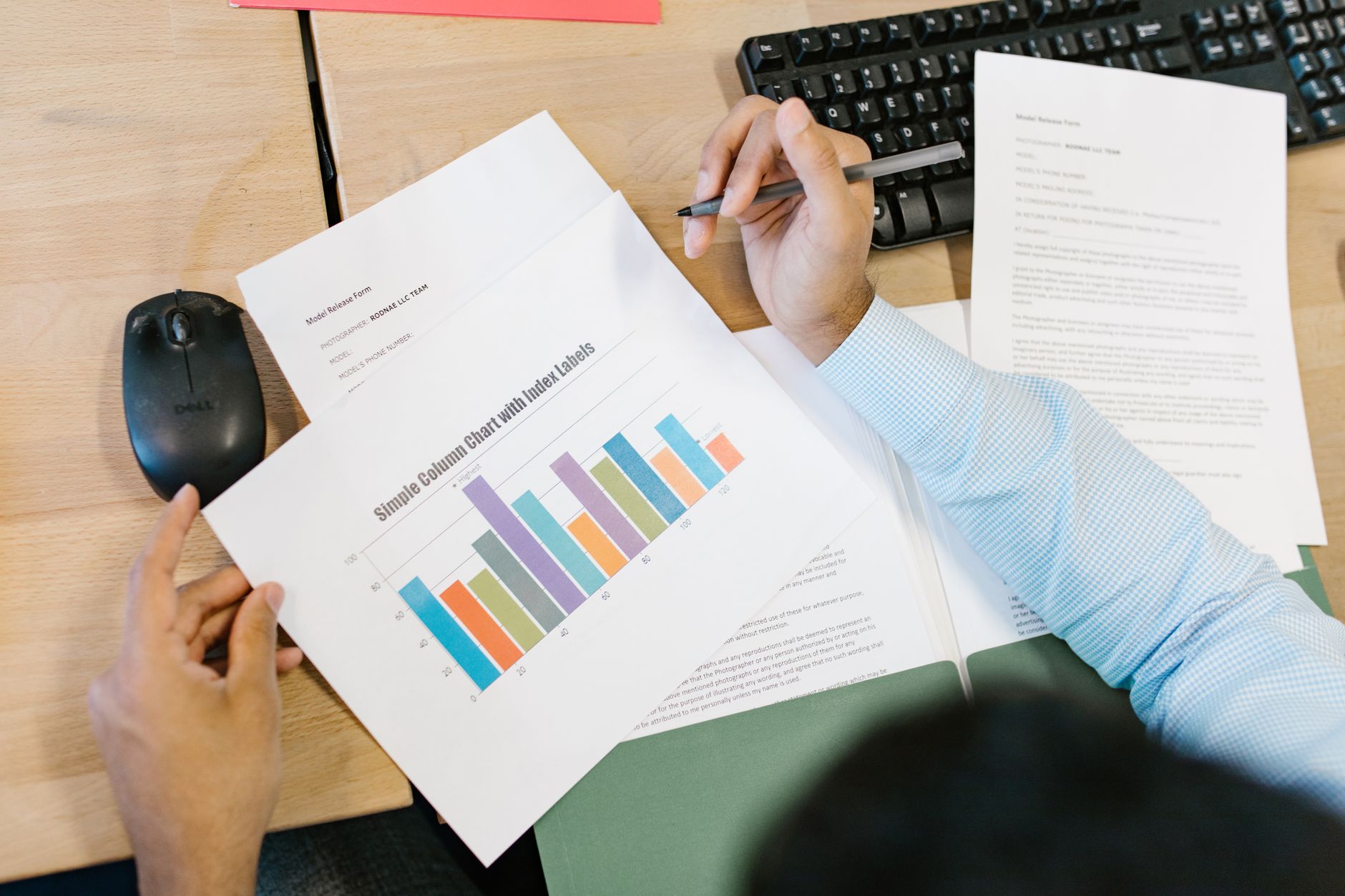 SaaS founder reviewing financial reports on a laptop with charts.